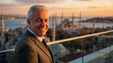 A close-up portrait of a happy, mature man with a brilliant, healthy smile. In the background, the Istanbul skyline is softly blurred during a beautiful sunset, symbolizing a successful dental tourism journey.