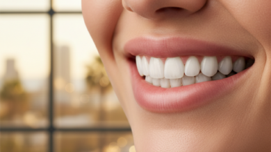 Close-up photorealistic image of a healthy, natural-looking human smile with perfect, bright teeth. The background is a blurred, modern dental clinic with a soft-focus hint of an Australian coastal city visible through a window. The image conveys confidence and oral health. No text visible.