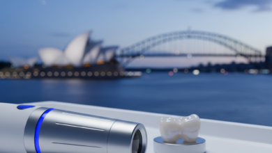Close-up, detailed shot of a modern, sterile dental instrument or a perfectly crafted ceramic dental crown on a white surface, with a very blurred Australian city skyline or coastline in the background, conveying advanced dental care.