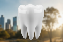 Close-up of a perfectly healthy, white molar tooth, sharp and clean, with a softly blurred, sunny Australian cityscape or natural landscape in the background, symbolizing dental care and location.