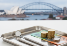 Close-up of sterile dental instruments on a tray, next to Australian dollar coins and banknotes. The background is a blurred image of an Australian city skyline with recognizable landmarks, suggesting the financial aspect of dental care in Australia.