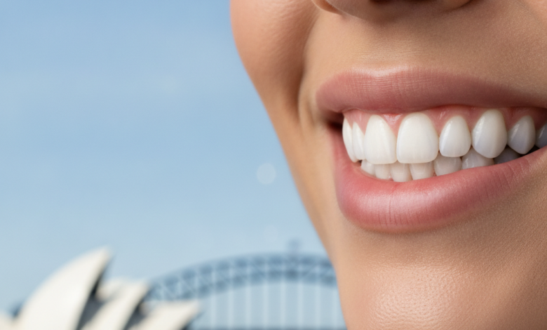 A photorealistic close-up of a person's healthy, natural smile, indicating successful dental restoration. In the softly blurred background, an iconic Sydney landmark like the Opera House or Harbour Bridge is visible. The image is bright, clean, and free of any text or branding.