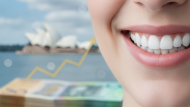 A close-up of a healthy, bright smile with a clean, soft focus. In the background, blurred financial concepts like abstract currency or a graph subtly blend with a distant, iconic Australian landmark, such as the Sydney Opera House, all rendered with a shallow depth of field. The image symbolizes dental health, financial considerations, and the Australian context.